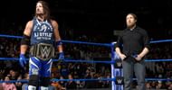 AJ Styles as WWE Champion, while Bryan looks on